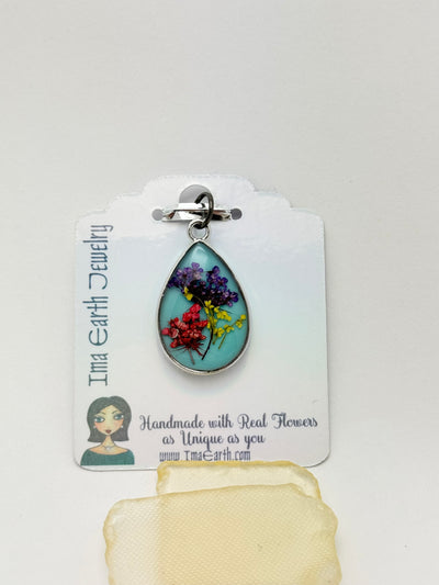 Real Flowers in Resin Pendant -  over Turquoise Blue • Silver Frame