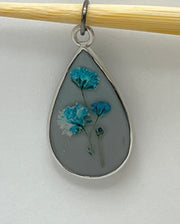 Real Flowers in Resin Pendant - Blue/Turquoise Resin over Grey Resin • Silver Frame