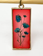 Real Flowers in Resin Pendant - Turquoise / Blue Flowers 💙 over Translucent Red Resin ❤️ • Gold Frame