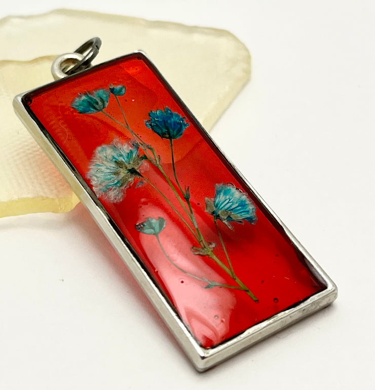 Real Flowers in Resin Pendant - Turquoise / Blue Flowers 💙 over Translucent Red Resin ❤️ • Silver Frame